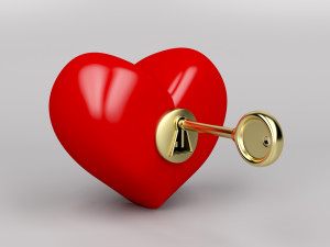 Red heart with gold key and keyhole