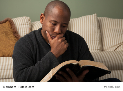 African American Studying the Bible at Home