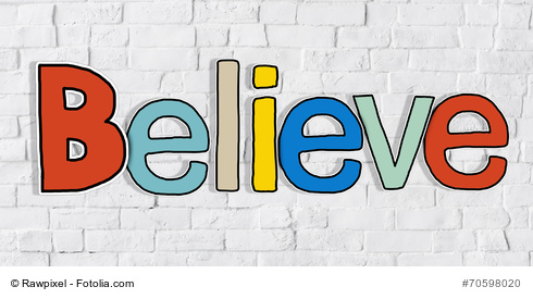 Believe Word and Brick Wall in Background